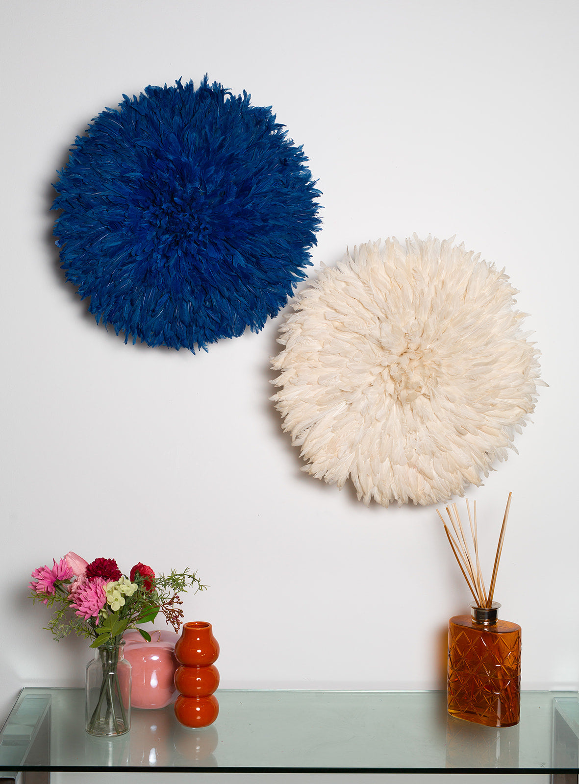 Handmade Juju hat wall decor in blue and white, perfect for interior design and Christmas gifts. Vibrant feather wall art in two-tone design