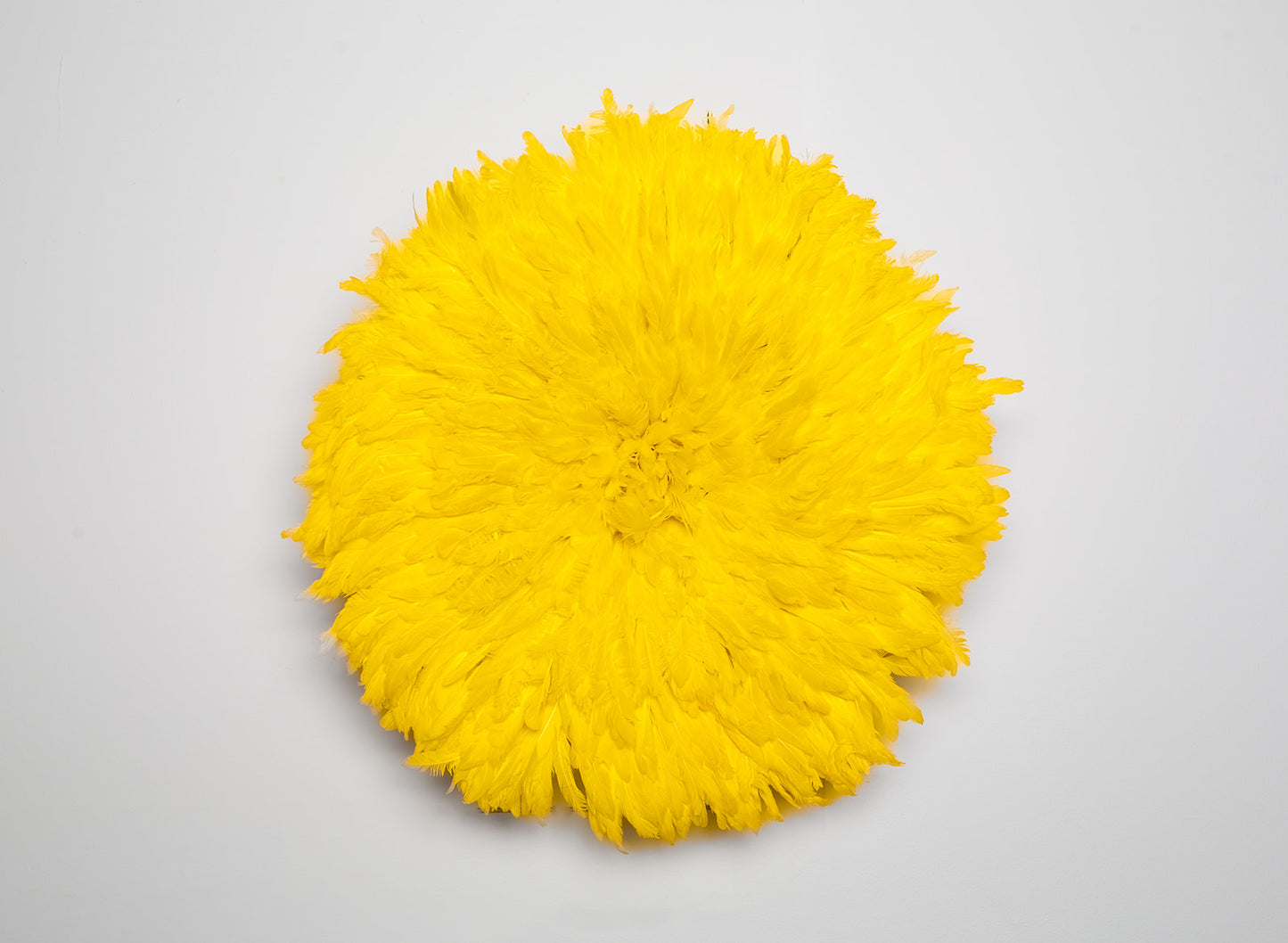 Handcrafted yellow Juju hat for interior wall hanging